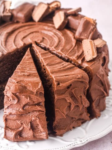 Image showing Bar One cake on a plate, there are two slices cut.