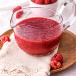 Raspberry filling shown in a glass pouring jug.