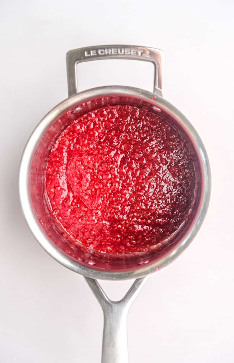 Image showing step 2 of how to make the raspberry filling for pistachio cupcakes.