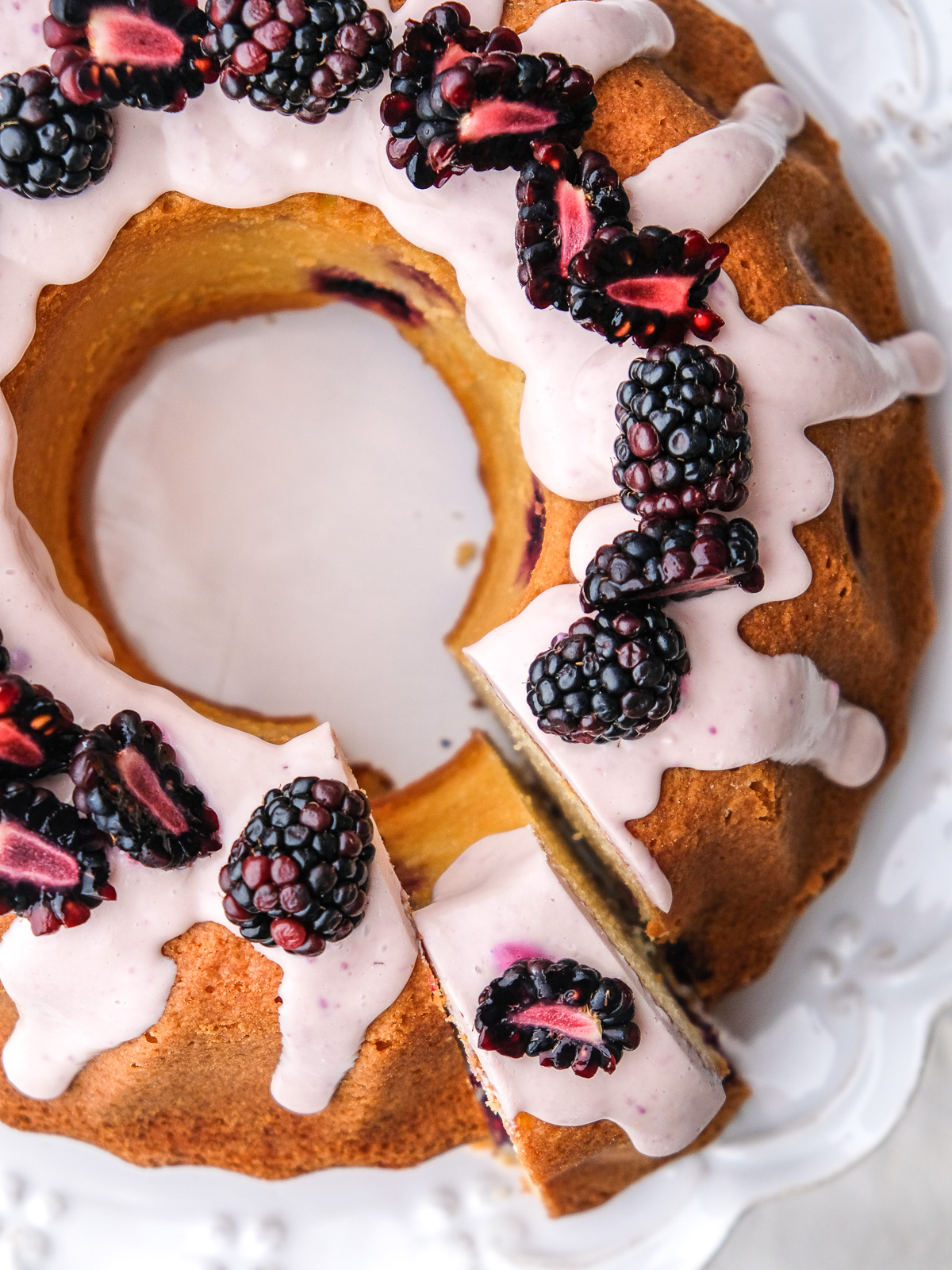Image shows the cake from above, a slice has been cut. 