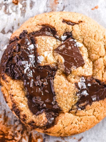 Bacon fat chocolate chip cookie shown from above,, you can see the melted chocolate.