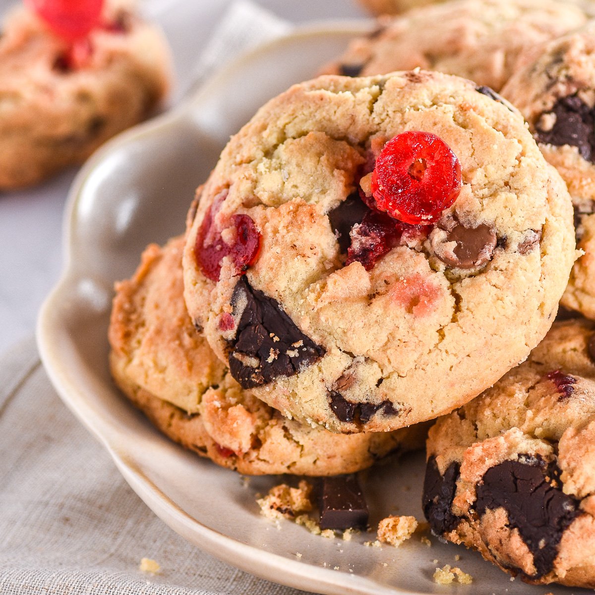 A pile of cookies shown on a fluted plate.