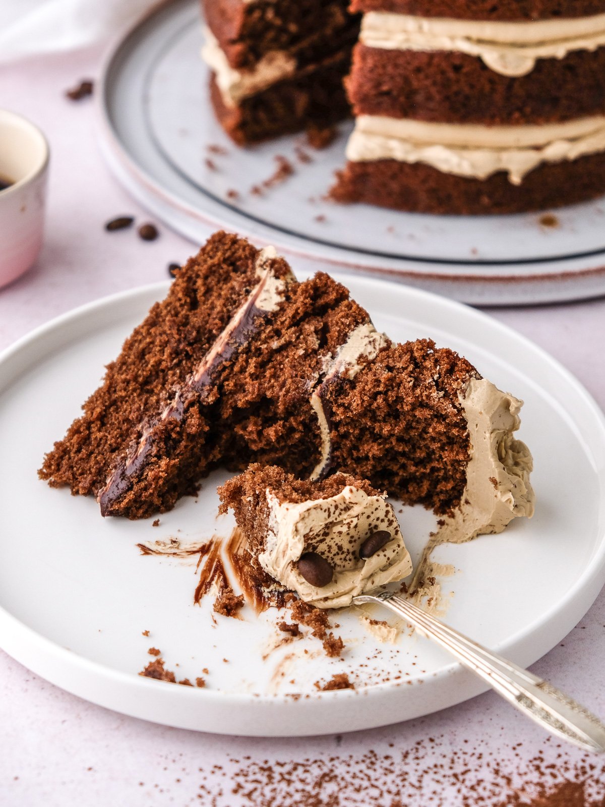 Image showing a slice of cake with. a fork through the cake.