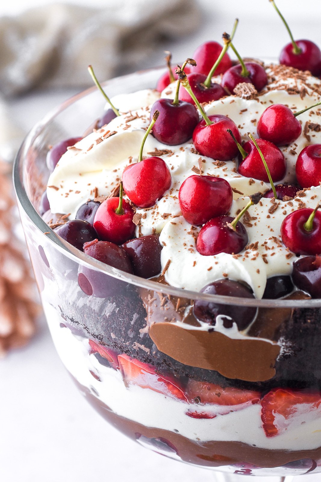 Black Forest Trifle shown up close s that you can see the fresh cherries and chocolate shavings on top of the dessert.