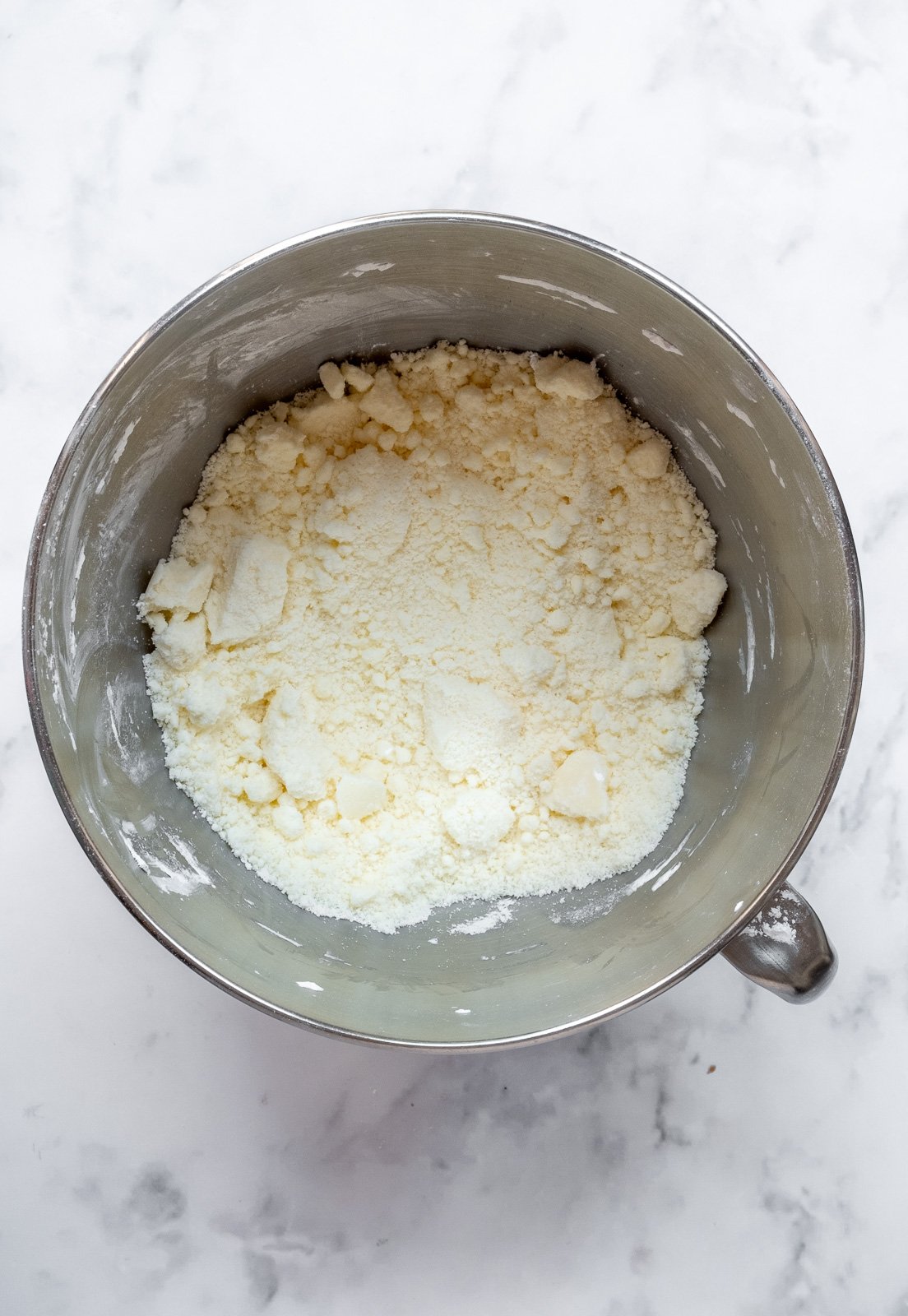 Image shows step 1 of how to make the cream cheese frosting.