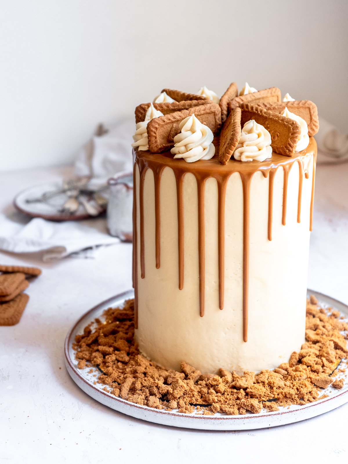 Image showing a tall layered birthday cake with drips.