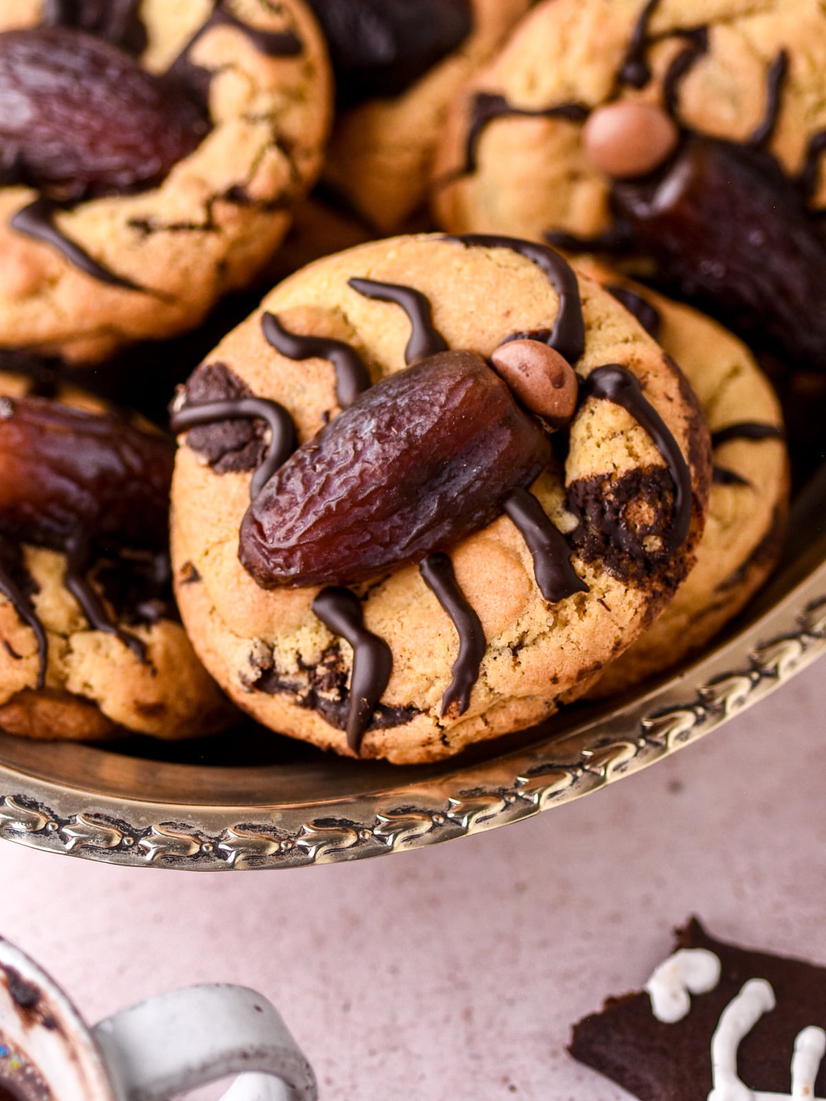 Image shows step 1 of how to decorate Halloween Cockroach Chocolate Chip Cookies.