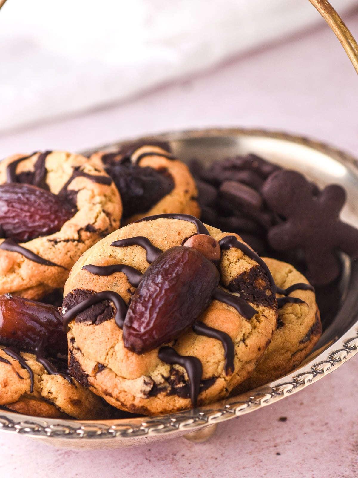 Halloween Cockroach Chocolate Chip Cookies shown in a basket next to other chocolate cookies.