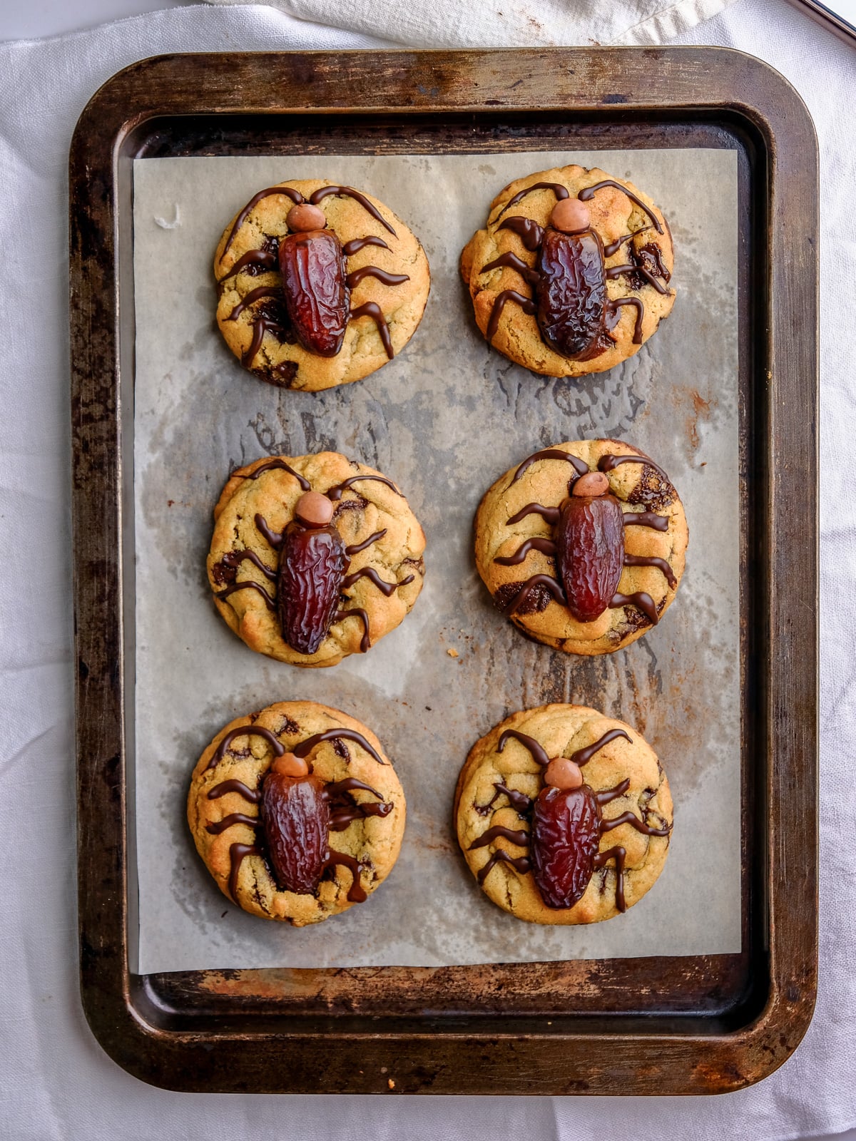 Image shows step 2 of how to decorate Halloween Cockroach Chocolate Chip Cookies.