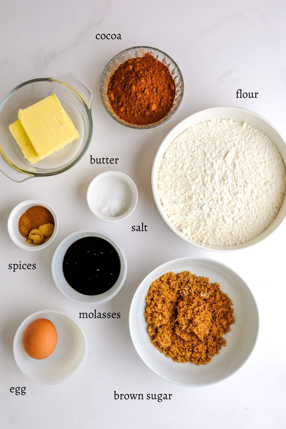 Ingredients for black cocoa gingerbread men cookies.